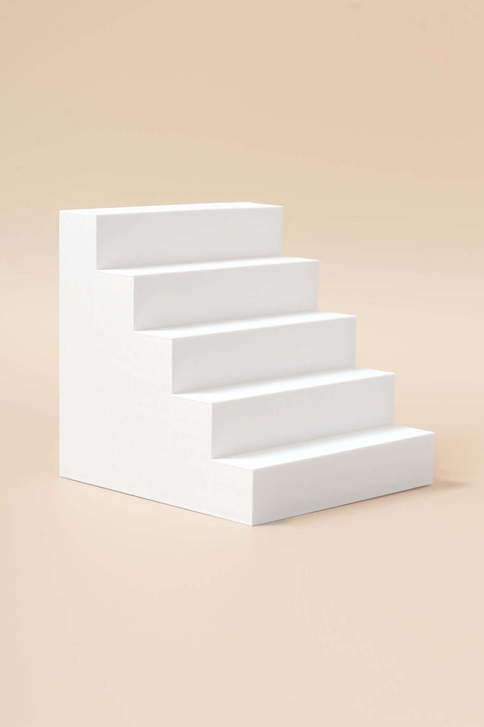 5 Step Stair Photography Prop in white, designed for enhancing product photography with elegance and dimension.