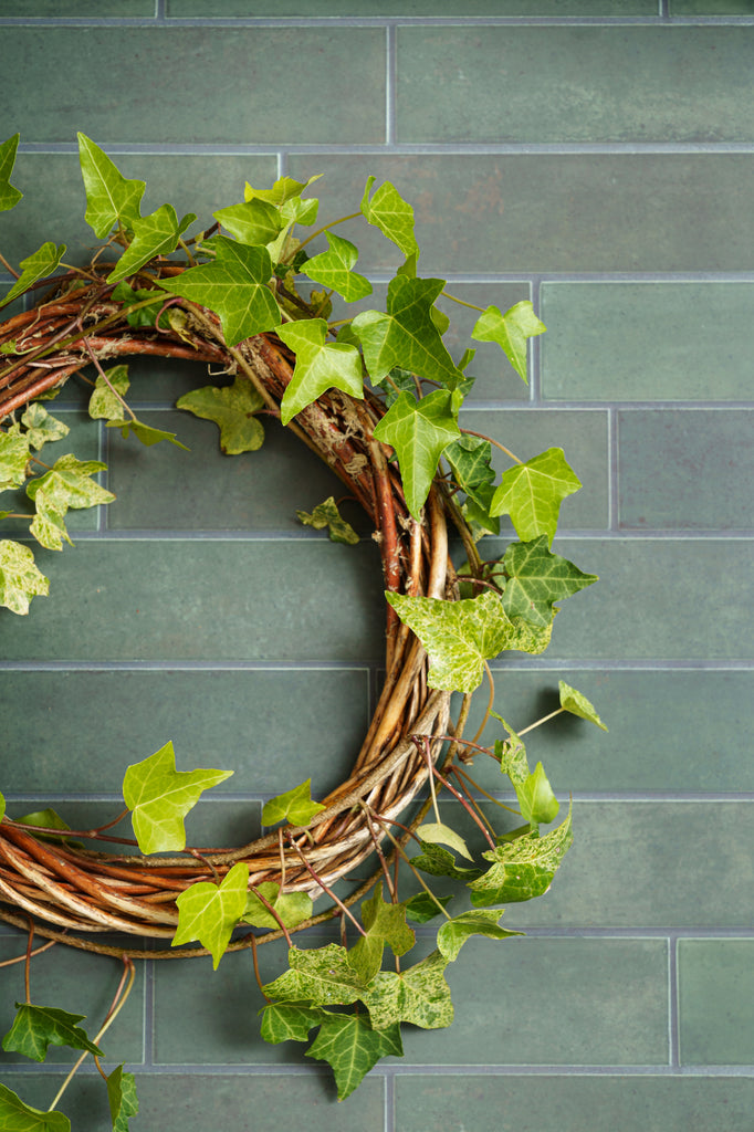 ivy wreath on green kitchen tiled backdrop