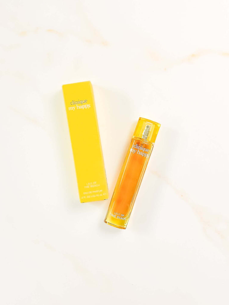 Perfume bottle and packaging on a warm marble background from CM Props & Backdrops 