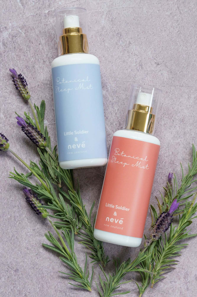 Botanical Sleep Mist bottles by neve with lavender and rosemary, showcasing calming scents for relaxation showcased on cheap stone backdrop.