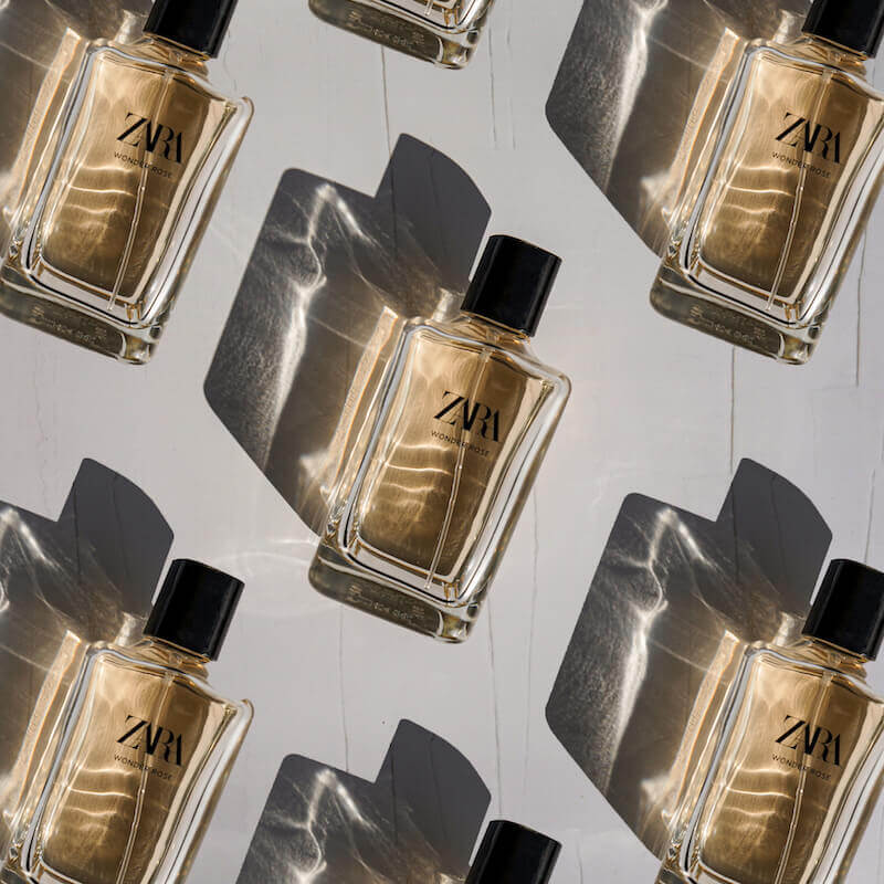 repeated bottled of zara perfume on vinyl backdrop by CM Props & Backdrops 